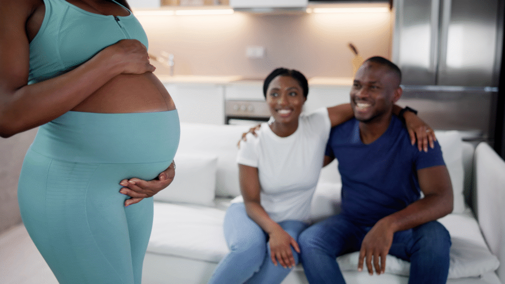 Couple watching pregnant woman